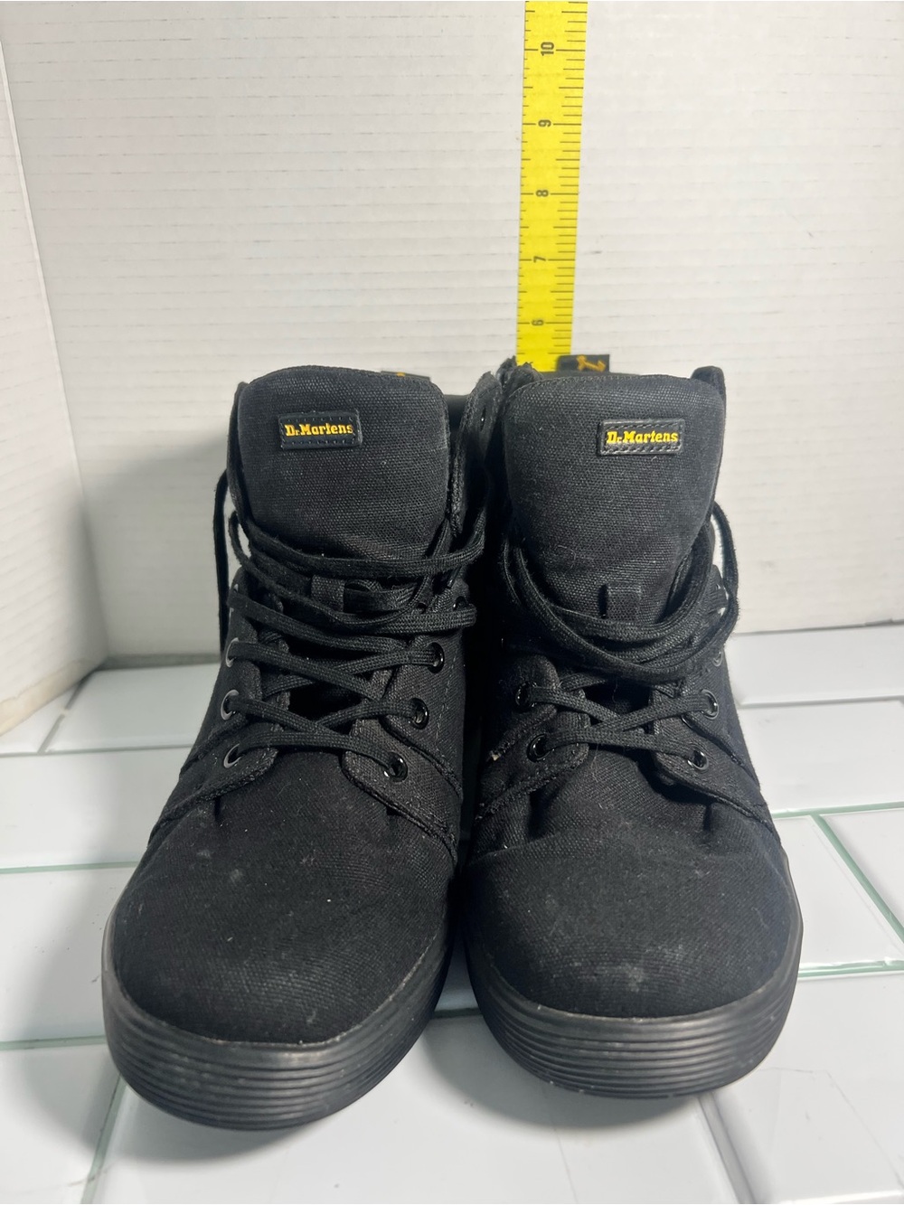 Dr. Martens women size 9
Black Canvas Lace-Up High Tops